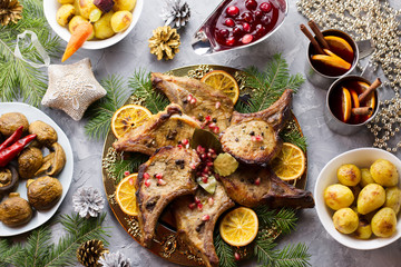 Christmas dinner with roasted meat steak, Christmas Wreath salad, baked potato, grilled vegetables, cranberry sauce.