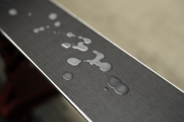 Preparation of skis for the winter season. The wax coating on the sliding surface of the ski