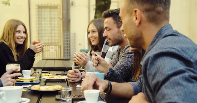 large group of friends in an outdoor cafeteria