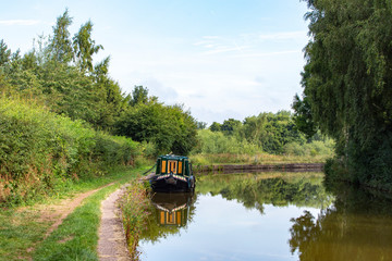 Fototapeta premium Narrow boat on the Trent and Mersey canal in Cheshire UK