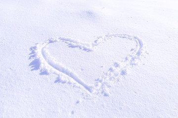 Handwriting heart shaped on snow