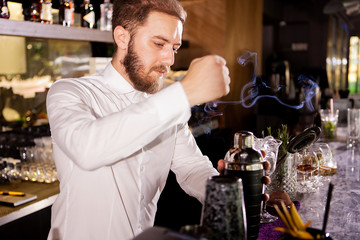 Alcohol cocktail on the bar. Bartender prepares an alcoholic cocktail . Delicious drink