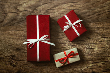 Christmas presents on wooden background, processed in vintage style