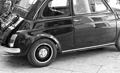 Italy: Details of old small car.