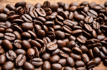 Coffee beans on a wooden surface. Copy-space. selective focus
