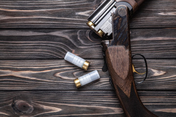 open hunting rifle on a wooden background