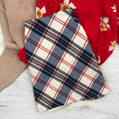 Women's short checkered skirt on a wooden background