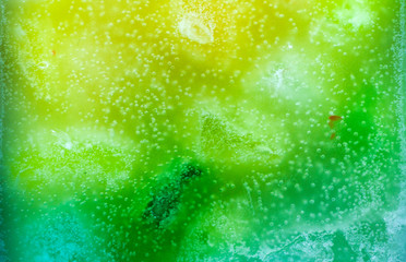 Colorful background, candle macro, air bubbles and wax, texture and wallpaper. Mixed and multicolored. 