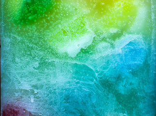 Obraz na płótnie Canvas Colorful background, candle macro, air bubbles and wax, texture and wallpaper. Mixed and multicolored. 