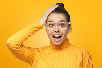 Young female shouting oh my god with open mouth, surprised by low price and sales, isolated on...