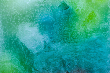 Colorful background, candle macro, air bubbles and wax, texture and wallpaper. Mixed and multicolored. 