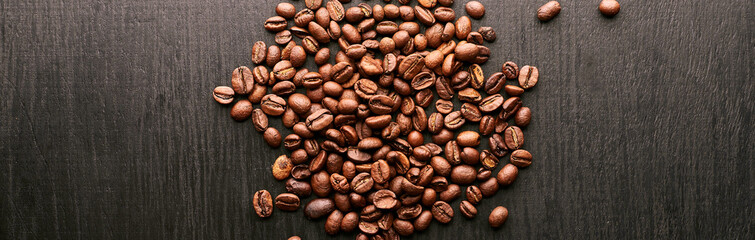 coffee beans in shape of heart on wooden background
