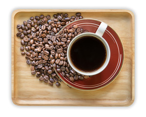 Coffee cup and coffee beans on white background, Top view