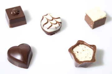 Many chocolates isolated in a white background