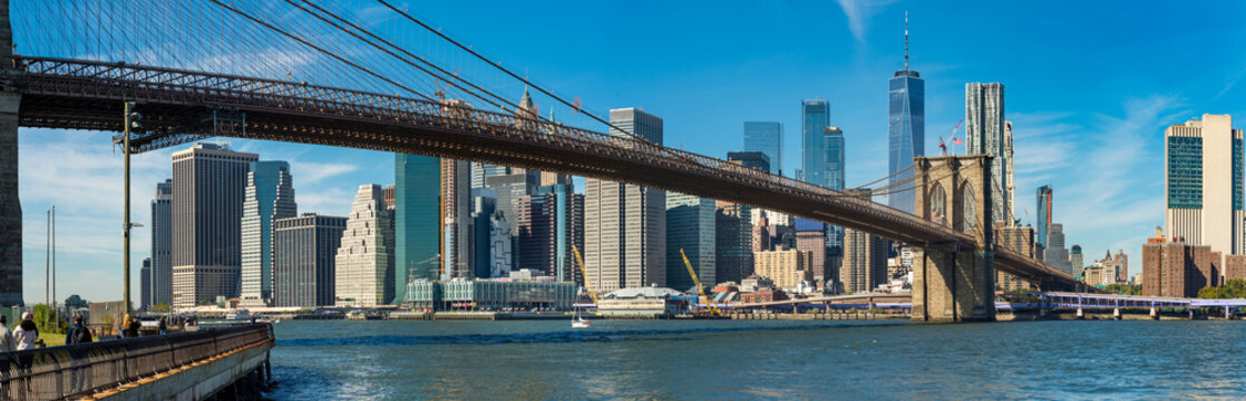 Iconic view of Brooklyn bridge over Manhatten skyscrapers in New York. © borisbelenky