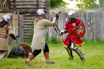 People wearing knight costumes during historical reenactment on annual Medieval Festival, held in...