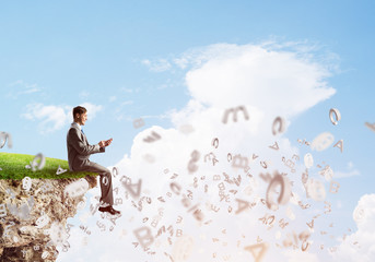 Student guy in suit with smartphone in hands send message