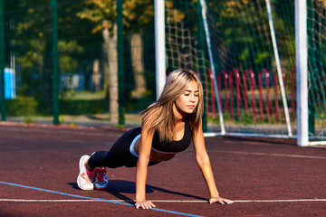 Sport girl. The girl is doing fitness exercises. Beautiful young