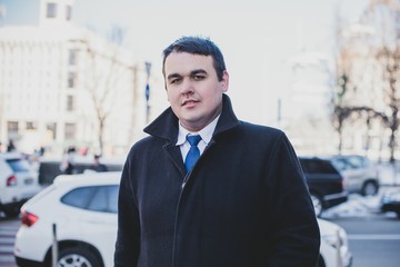  Young plus size man in city streets, plump people concept, one in big city life. Image of...