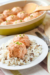 Chicken meatballs in creamy tomato sauce with rice