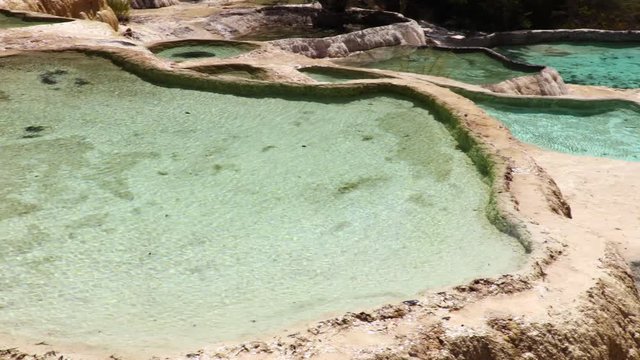 Travertine landscapes and pools of Huanglong (literally: yellow dragon), Sichuan, China. Huanglong was declared a World Heritage Site by UNESCO in 1992.