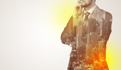 Businessman in suit standing thinking with metropolis graphic 