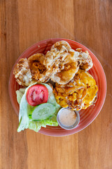 Gourmet cheeseburger and handmade onion rings