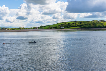 Overview of the estuary of the Blackwater River, with the solitude of a fishing boat