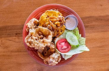 Gourmet cheeseburger and handmade onion rings