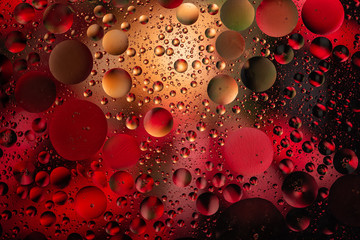 water drops on glass with colorful background, close-up 