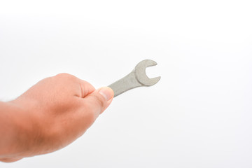 Man hand holding wrench tool , isolated on white background. Can use for fix at home by your self concept. Copy space for text or objects.
