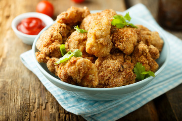 Homemade chicken nuggets with tomato sauce