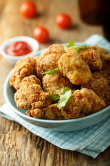 Homemade chicken nuggets with tomato sauce