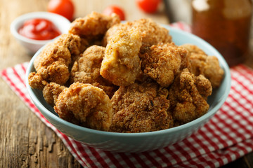 Homemade chicken nuggets with tomato sauce