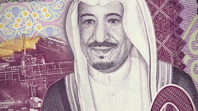 Saudi Arabia King Salman on 5 riyal (2016) banknote rotating, Saudi Arabian money close up. 4K UHD video footage