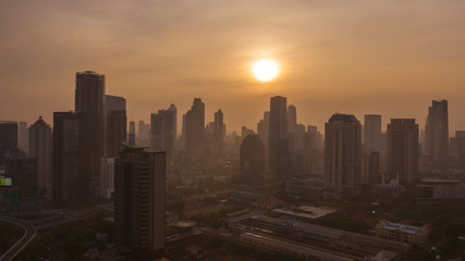 Jakarta cityscape with office buildings at sunset