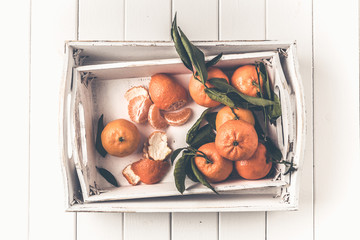 Clementines tangerines in a white tray