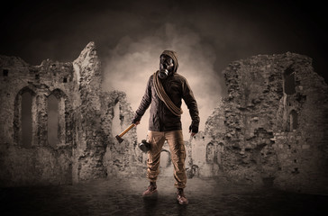 Fototapeta na wymiar Hazard, menace man in a ruined crumbly building with arms on his hand 