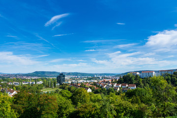 Fototapeta na wymiar Germany, Stuttgart Killesberg houses between green trees from city park above