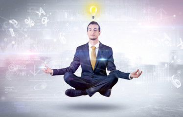 Businessman meditates with enlightenment data reports and financial concept
