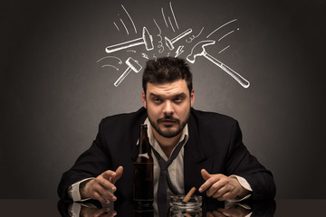 Young drunk disappointed man with hangover concept

