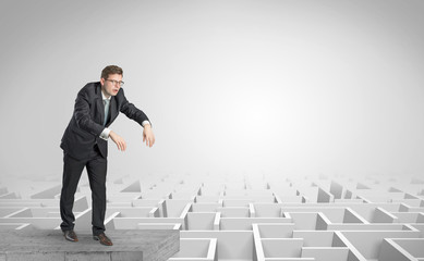 Zombi elegant businessman on the top of a labyrinth
