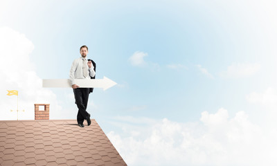 Businessman and pointing banner