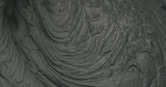 Slow motion mixing water in micro concrete plaster