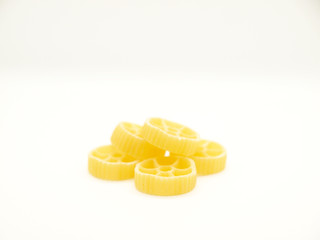 Raw round pasta on white background