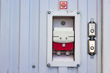 fire sensor on the wall with the inscription in case of fire break off