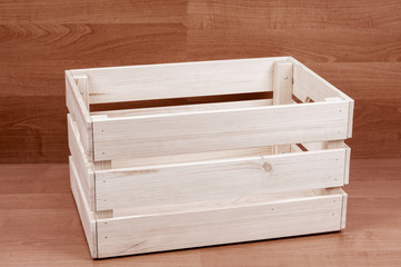 Empty wooden box on brown floor background
