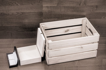 A few empty wooden boxes on brown floor background