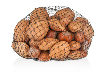 Different kind of nuts close up in grid package on white baclground