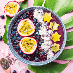 Smoothie acai bowl served in bowl on pink table